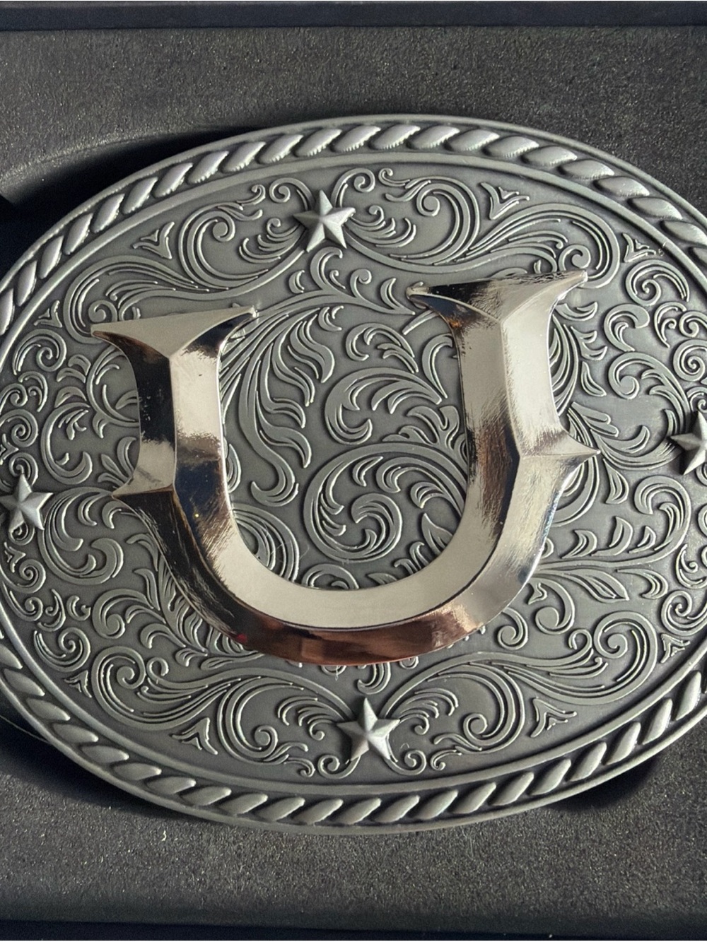 Silver Western Oval Belt Buckle with Decorative 'U' Emblem